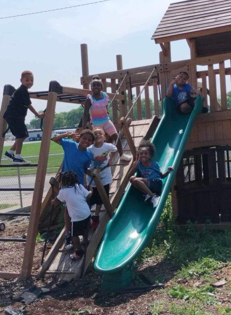 Kids playing in a playground in our childcare center in lansing, illinois